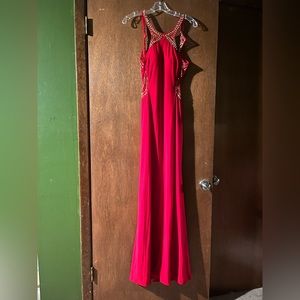 Blonde Nite full length prom dress with sequences and an open back.